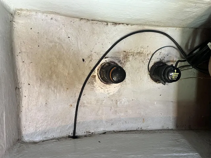 Nirvana Yacht Photos Pics Bilge area of 2001 Beneteau First 40.7 with wiring and fittings visible.