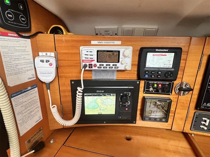 Nirvana Yacht Photos Pics Control panel of a 2001 Beneteau First 40.7 sailboat with navigation and communication equipment.