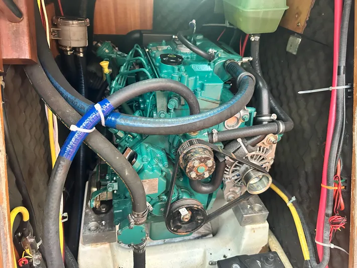 Nirvana Yacht Photos Pics Engine compartment of a 2001 Beneteau First 40.7 sailboat, showcasing detailed mechanical components.