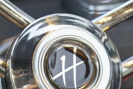 Yacht Photos Pics Close-up of Hanover 305 Black & Orange Edition 2025 steering wheel emblem.
