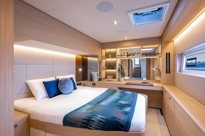  Yacht Photos Pics Luxurious interior of 2026 Lagoon 60 yacht with elegant bedroom design.