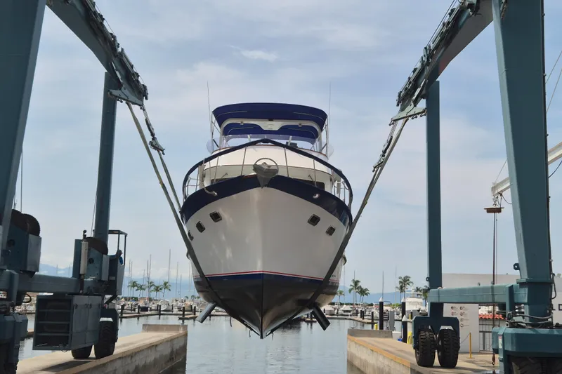 Ballena Blanca Yacht Photos Pics 1985 DeFever 44 Trawler in dry dock, marina background, blue sky.