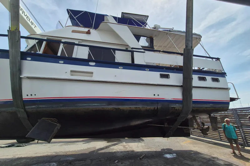 Ballena Blanca Yacht Photos Pics 1985 DeFever 44 Trawler lifted for maintenance at a shipyard.