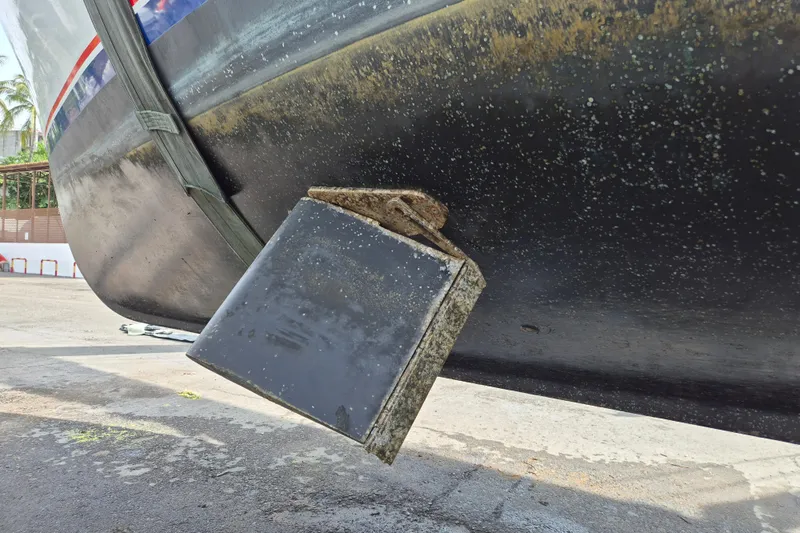 Ballena Blanca Yacht Photos Pics 1985 DeFever 44 Trawler hull detail with rudder, docked for maintenance.