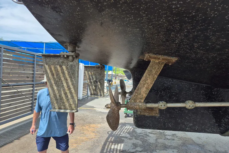 Ballena Blanca Yacht Photos Pics 1985 DeFever 44 Trawler underside with propeller and rudder in dry dock.