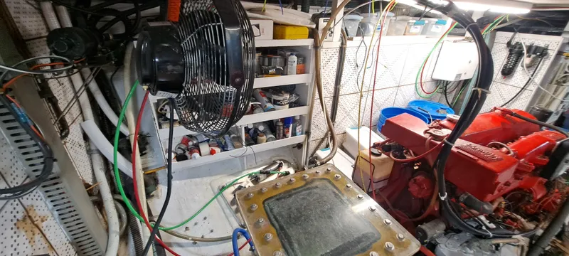 Ballena Blanca Yacht Photos Pics Engine room of 1985 DeFever 44 Trawler with tools and equipment.