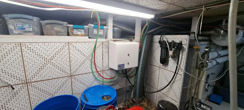 Ballena Blanca Yacht Photos Pics Engine room of 1985 DeFever 44 Trawler with storage bins and equipment.