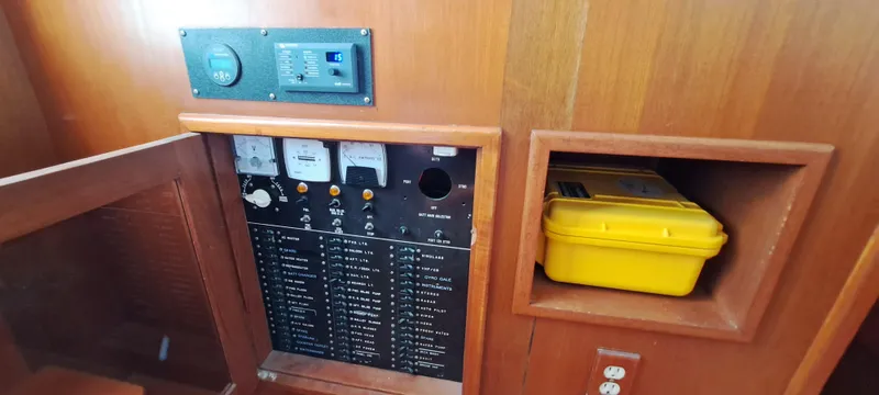 Ballena Blanca Yacht Photos Pics Electrical panel and storage compartment on a 1985 DeFever 44 Trawler boat.