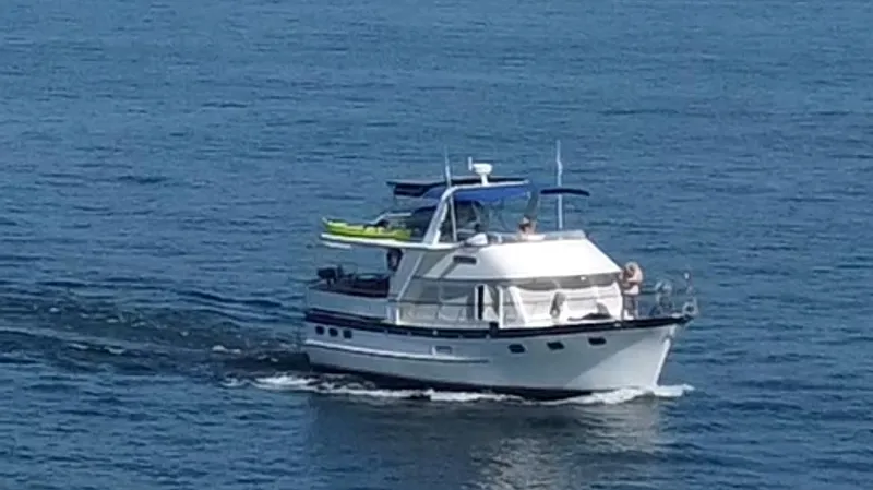 Ballena Blanca Yacht Photos Pics 1985 DeFever 44 Trawler cruising on open water.