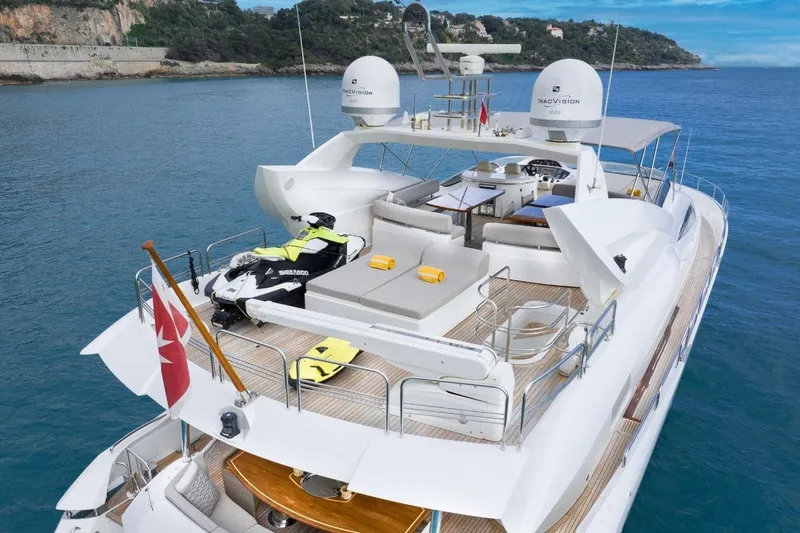 Sunseeker 90 Yacht Yacht Photos Pics Luxurious 2006 Sunseeker 90 Yacht with spacious deck and jet ski, cruising in scenic waters.