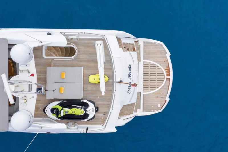 Sunseeker 90 Yacht Yacht Photos Pics Aerial view of 2006 Sunseeker 90 Yacht with jet ski on deck, surrounded by blue water.