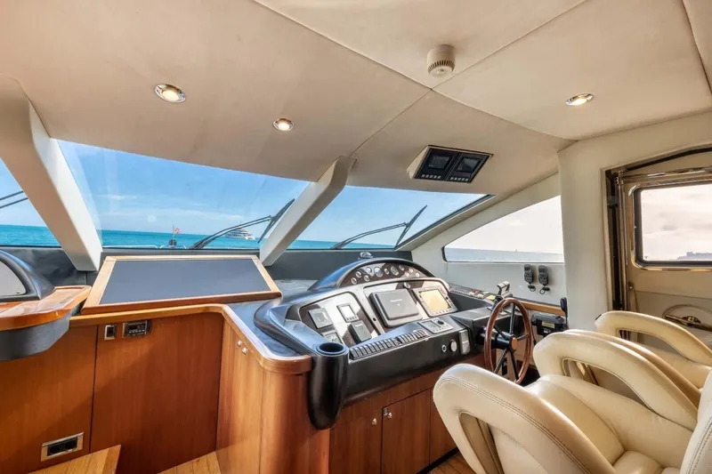 Sunseeker 90 Yacht Yacht Photos Pics Luxurious interior of 2006 Sunseeker 90 Yacht cockpit with ocean view.