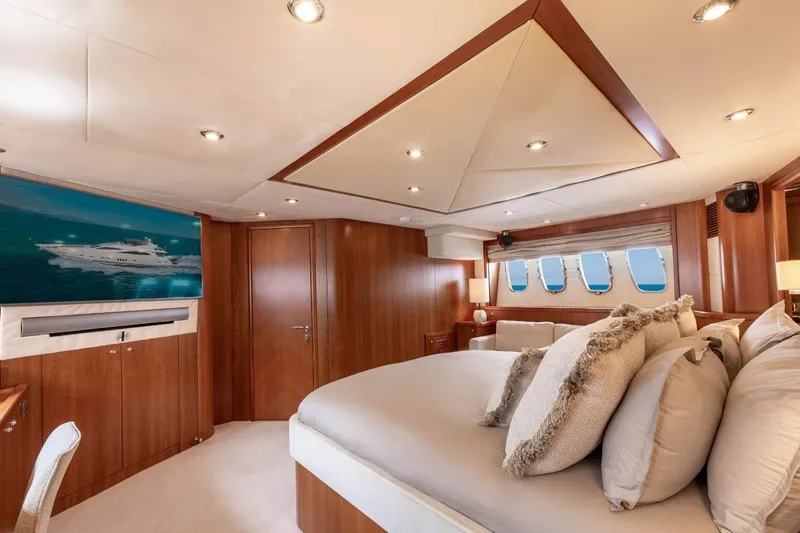 Sunseeker 90 Yacht Yacht Photos Pics Luxurious 2006 Sunseeker 90 Yacht bedroom with elegant wood paneling and plush bedding.