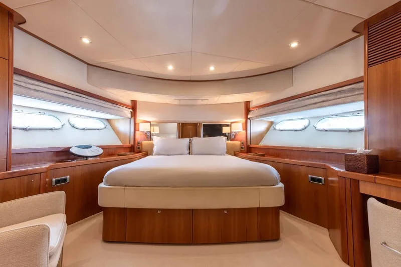 Sunseeker 90 Yacht Yacht Photos Pics Luxurious cabin interior of 2006 Sunseeker 90 Yacht with elegant wood finishes.