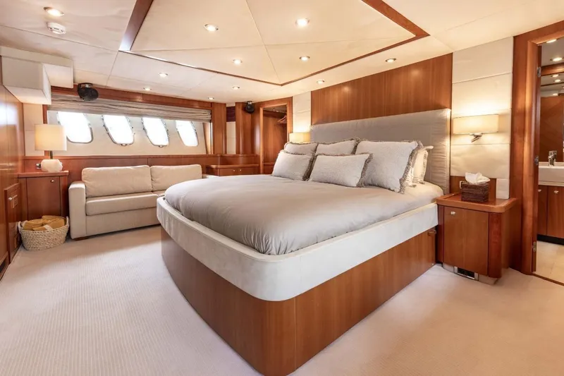 Sunseeker 90 Yacht Yacht Photos Pics Luxurious 2006 Sunseeker 90 Yacht bedroom with elegant wood finishes and plush bedding.