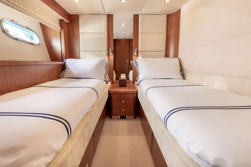 Sunseeker 90 Yacht Yacht Photos Pics Luxurious twin cabin interior on 2006 Sunseeker 90 Yacht, featuring elegant wood finishes.