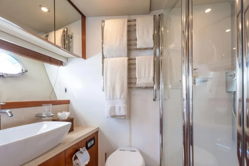 Sunseeker 90 Yacht Yacht Photos Pics Luxurious bathroom in 2006 Sunseeker 90 Yacht with modern fixtures and elegant design.