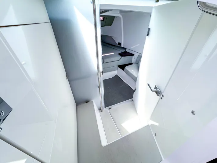  Yacht Photos Pics 2023 Axopar 37 XC CROSS CABIN interior with modern white and gray design.