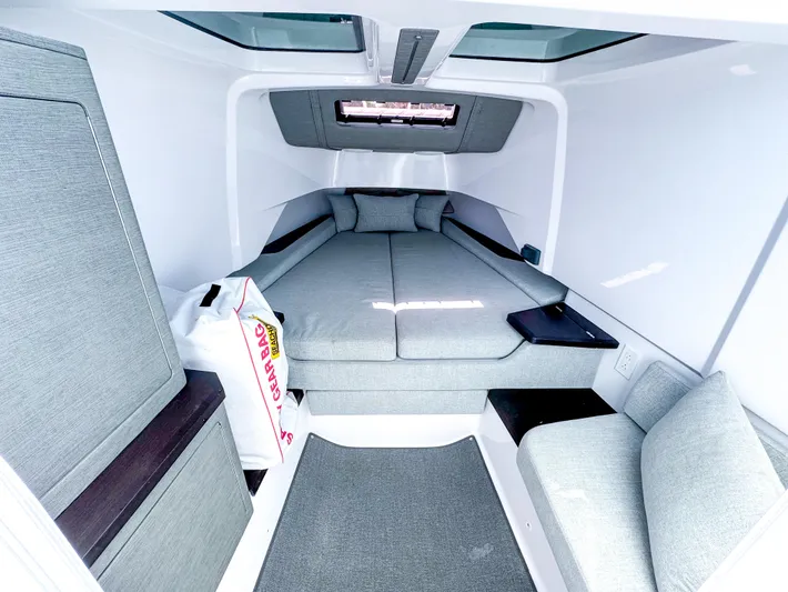  Yacht Photos Pics 2023 Axopar 37 XC CROSS CABIN interior with cozy seating and modern design.