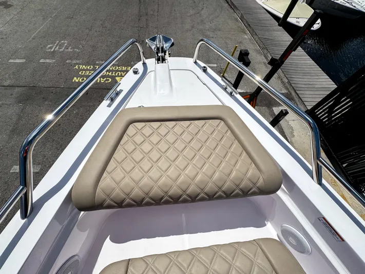  Yacht Photos Pics 2023 Axopar 37 XC CROSS CABIN bow with diamond-stitched seating and stainless steel railings.