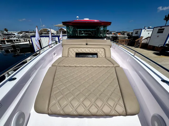  Yacht Photos Pics 2023 Axopar 37 XC CROSS CABIN with beige quilted seating, docked at a marina.