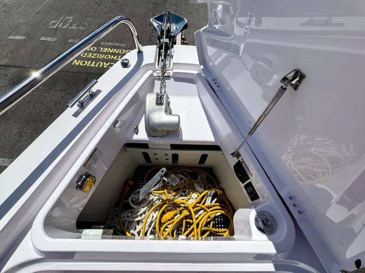  Yacht Photos Pics Anchor storage compartment on 2023 Axopar 37 XC CROSS CABIN with ropes and cables.