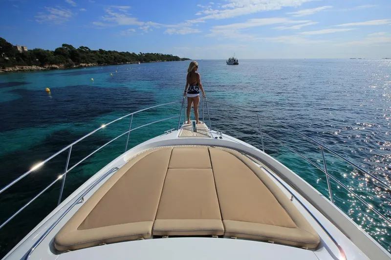 Annie Yacht Photos Pics Woman on Nimbus 405 Coup&eacute; yacht, enjoying ocean view, 2023 model.