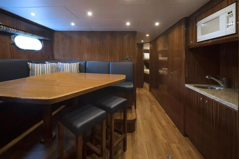 Renaissance Yacht Photos Pics Luxurious 2016 Hargrave Raised Pilothouse yacht interior with dining area and kitchenette.