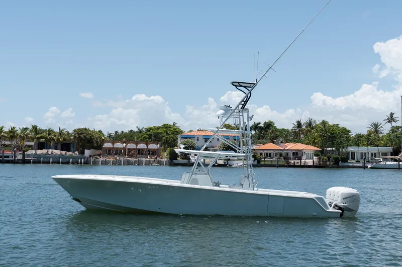  Yacht Photos Pics 2017 SeaVee Z39 boat on water, with waterfront homes in the background.