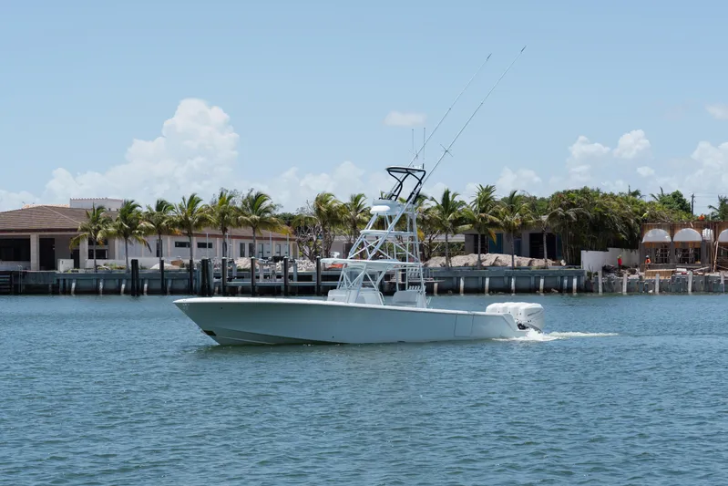  Yacht Photos Pics 2017 SeaVee Z39 boat cruising on a sunny day near waterfront homes.