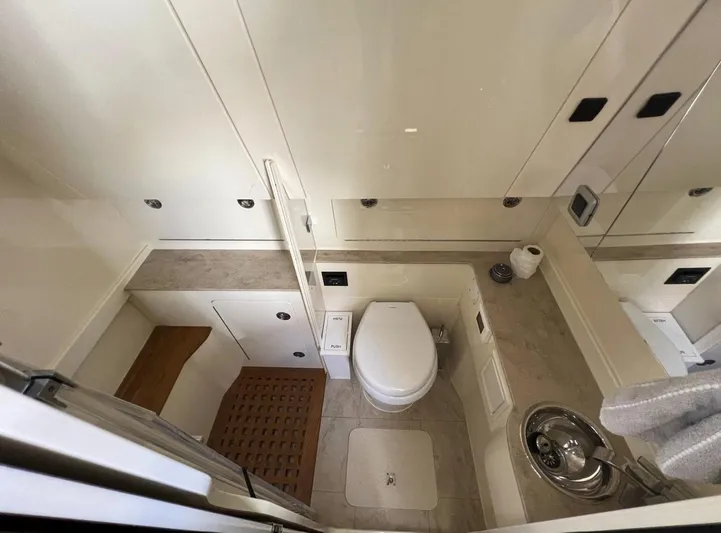 Zooropa Yacht Photos Pics Luxurious 2016 Scout 420 LXF yacht bathroom with modern fixtures and elegant design.