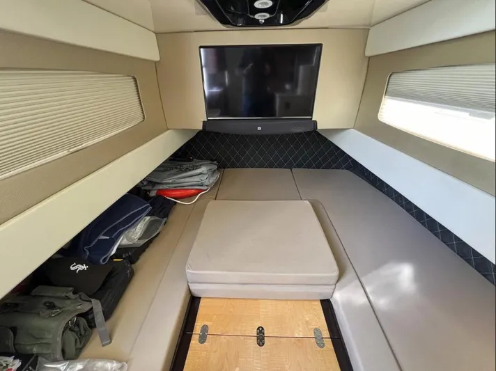 Zooropa Yacht Photos Pics Interior cabin of 2016 Scout 420 LXF boat with seating and storage.