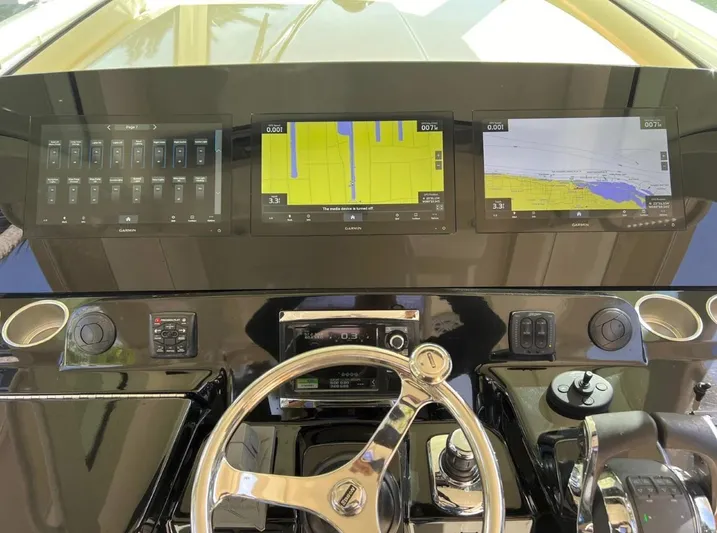 Zooropa Yacht Photos Pics Control panel of 2016 Scout 420 LXF boat with Garmin navigation displays.