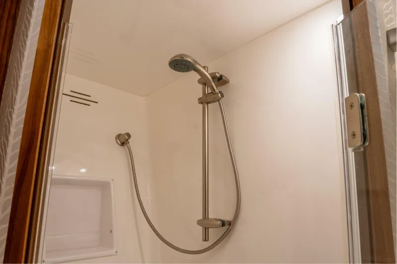 Silvertime Yacht Photos Pics Shower area in 2018 Viking 80 Enclosed Bridge yacht, featuring modern fixtures.