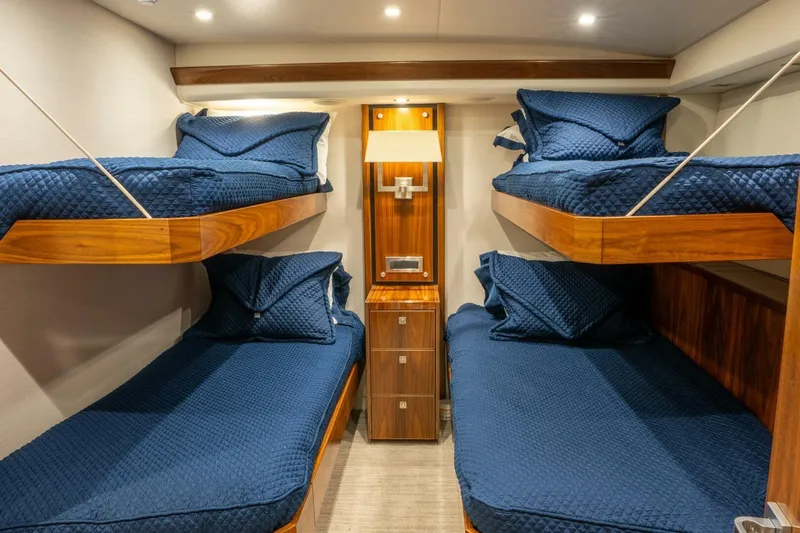 Silvertime Yacht Photos Pics Bunk beds with blue bedding in 2018 Viking 80 Enclosed Bridge yacht cabin.