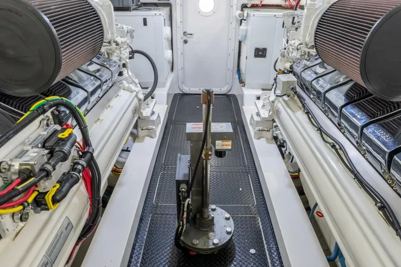 Silvertime Yacht Photos Pics Engine room of 2018 Viking 80 Enclosed Bridge yacht, showcasing dual engines and equipment.