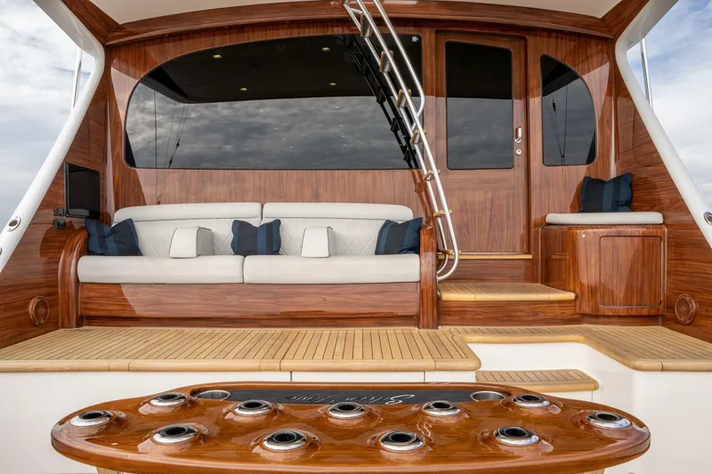 Silvertime Yacht Photos Pics Luxurious 2018 Viking 80 Enclosed Bridge yacht with elegant wooden interior and plush seating.