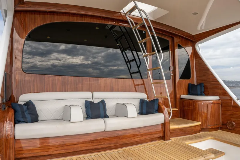 Silvertime Yacht Photos Pics Luxurious 2018 Viking 80 Enclosed Bridge yacht interior with plush seating and elegant wood finish.