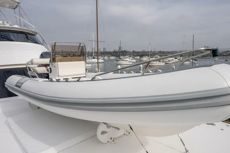Silvertime Yacht Photos Pics 2018 Viking 80 Enclosed Bridge yacht with tender on deck, docked in marina.