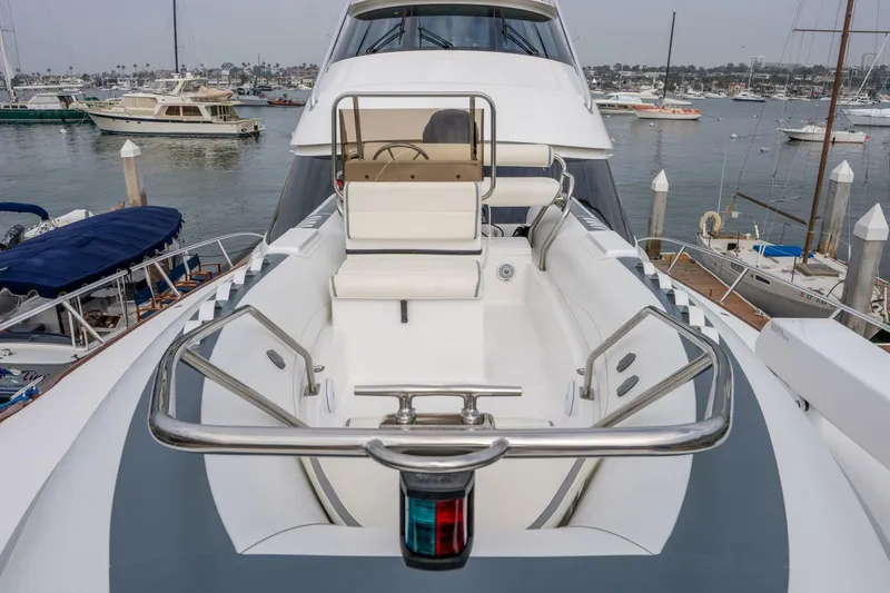Silvertime Yacht Photos Pics 2018 Viking 80 Enclosed Bridge yacht with sleek design in a marina setting.