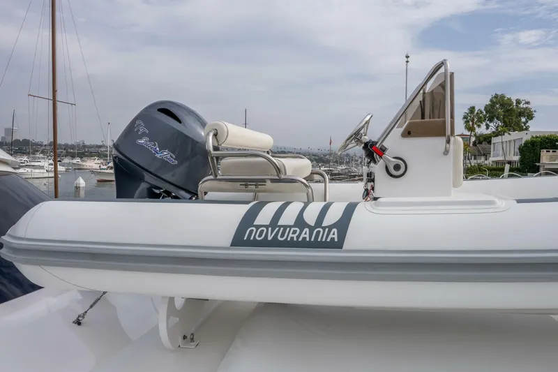 Silvertime Yacht Photos Pics Novurania boat on a 2018 Viking 80 Enclosed Bridge yacht, docked at a marina.