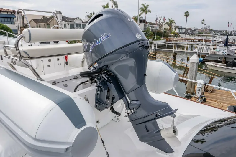Silvertime Yacht Photos Pics 2018 Viking 80 Enclosed Bridge yacht with outboard motor, docked in a marina.