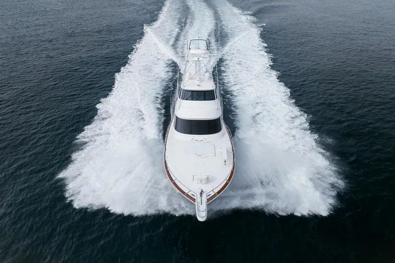 Silvertime Yacht Photos Pics 2018 Viking 80 Enclosed Bridge yacht cruising on open water, aerial view.