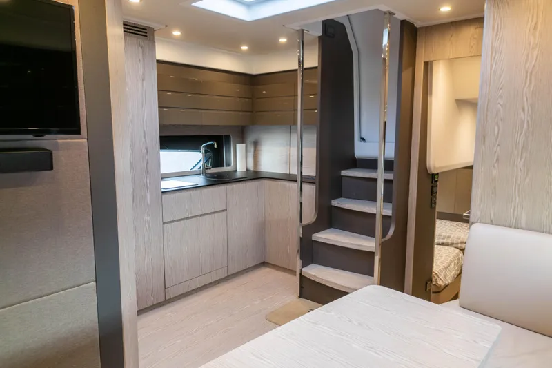  Yacht Photos Pics Luxurious interior of 2020 Azimut Atlantis 45 yacht with modern kitchen and cozy seating area.