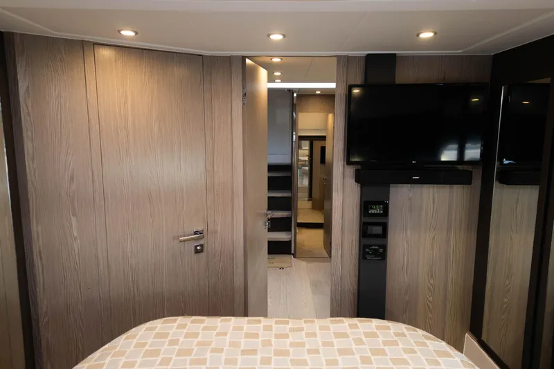  Yacht Photos Pics Interior of 2020 Azimut Atlantis 45 yacht with modern wood paneling and mounted TV.