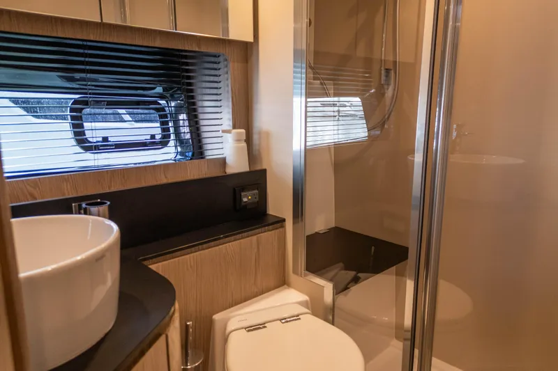  Yacht Photos Pics Luxurious bathroom interior of 2020 Azimut Atlantis 45 yacht with modern fixtures.