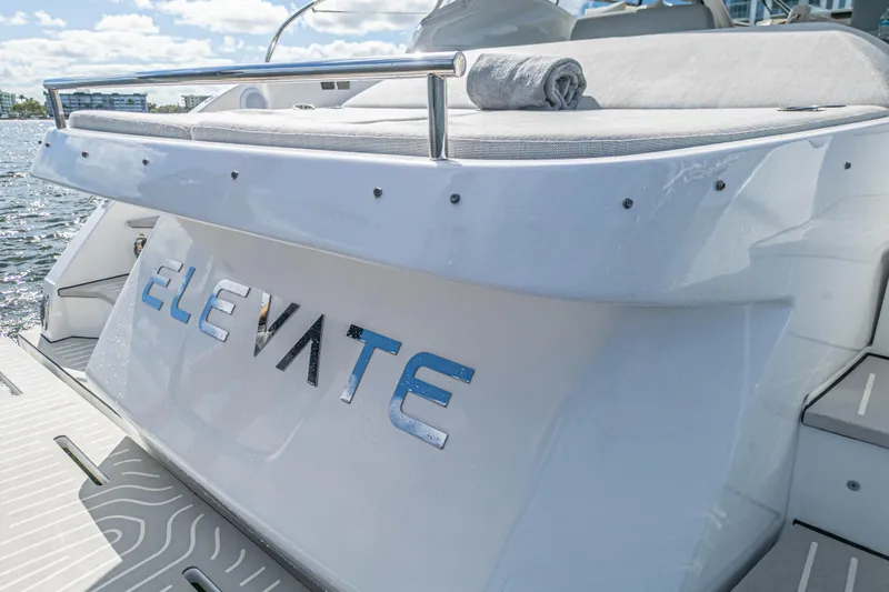  Yacht Photos Pics 2020 Azimut Atlantis 45 yacht with "Elevate" name, docked by the water.