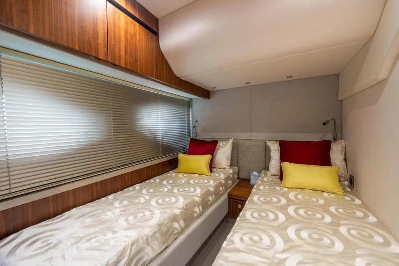  Yacht Photos Pics Interior of 2020 Sunseeker Manhattan 52 yacht with twin beds and modern decor.