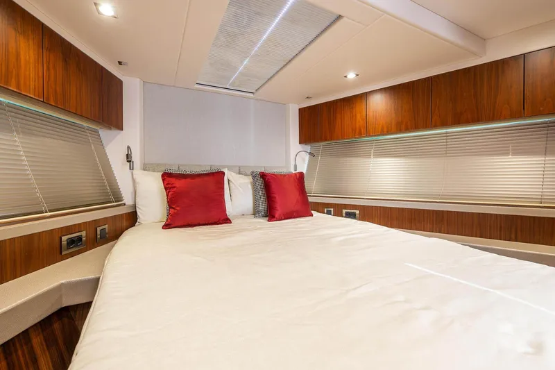  Yacht Photos Pics Luxurious cabin interior of 2020 Sunseeker Manhattan 52 yacht with elegant bedding.