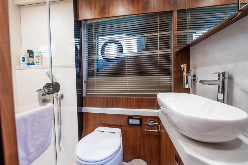  Yacht Photos Pics Luxurious bathroom in 2020 Sunseeker Manhattan 52 yacht with modern fixtures and elegant design.